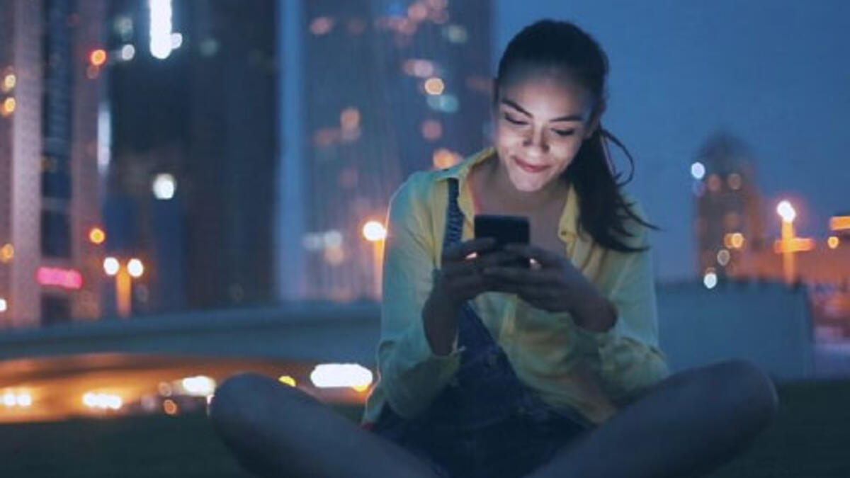 Student looking at her smart phone