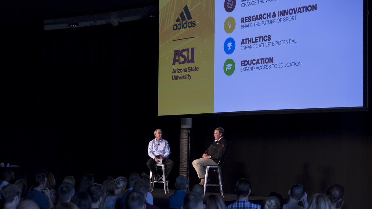Adidas North America CEO Mark King and ASU President Michael Crow speak at adidas headquarters