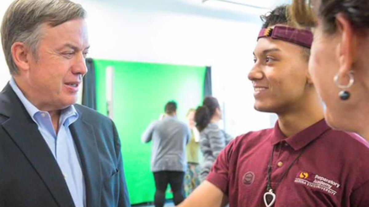 Michael Crow greets ASU Preparatory Academy students