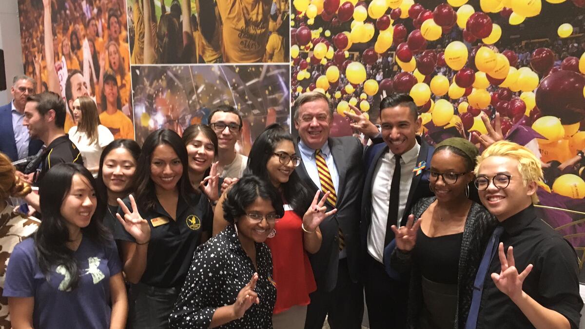 ASU President Michael Crow celebrates with student leaders at the opening of the Student Pavilion