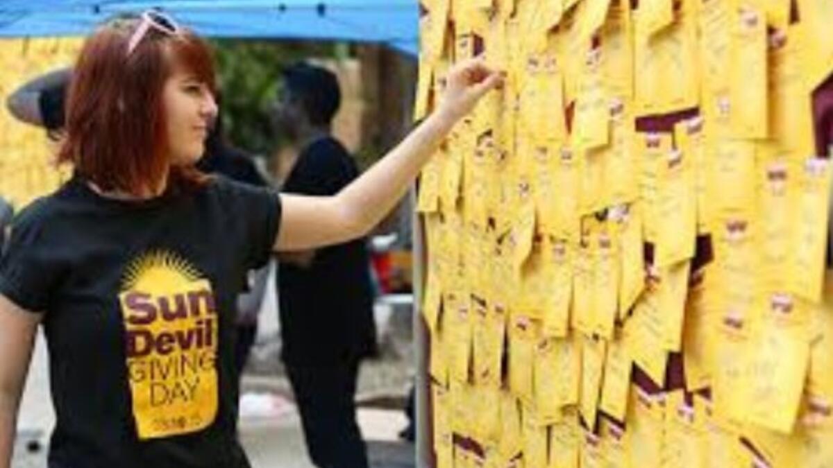 Student posting an idea on Sun Devil Giving Day